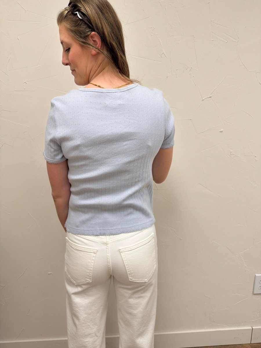 Back view of Pointelle V Neck Top on model showing relaxed silhouette — Three Boutique
