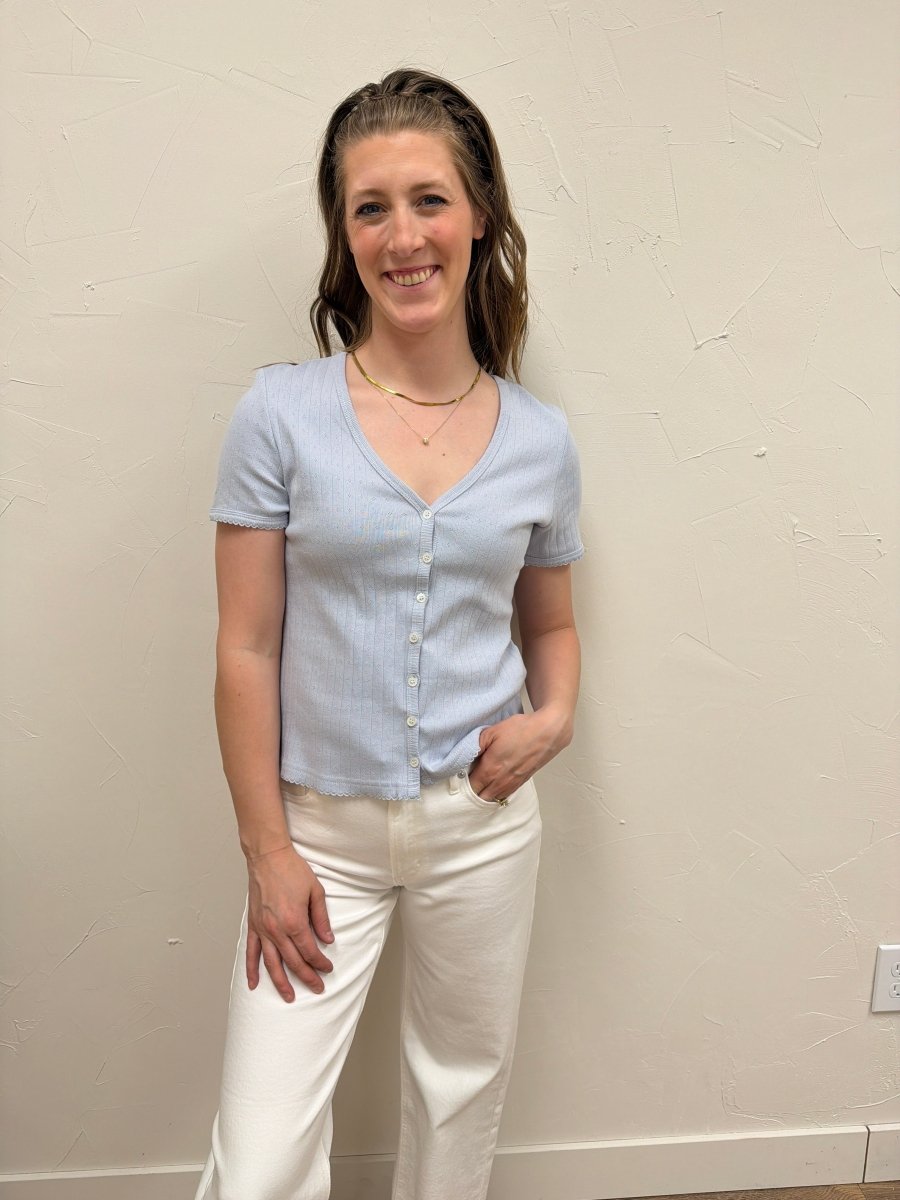 Lifestyle image of model wearing Pointelle V Neck Top styled with casual denim — Three Boutique