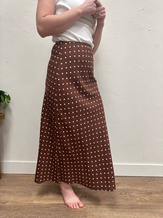 Side view of A-line skirt showing flare and movement — Three:Twelve Boutique