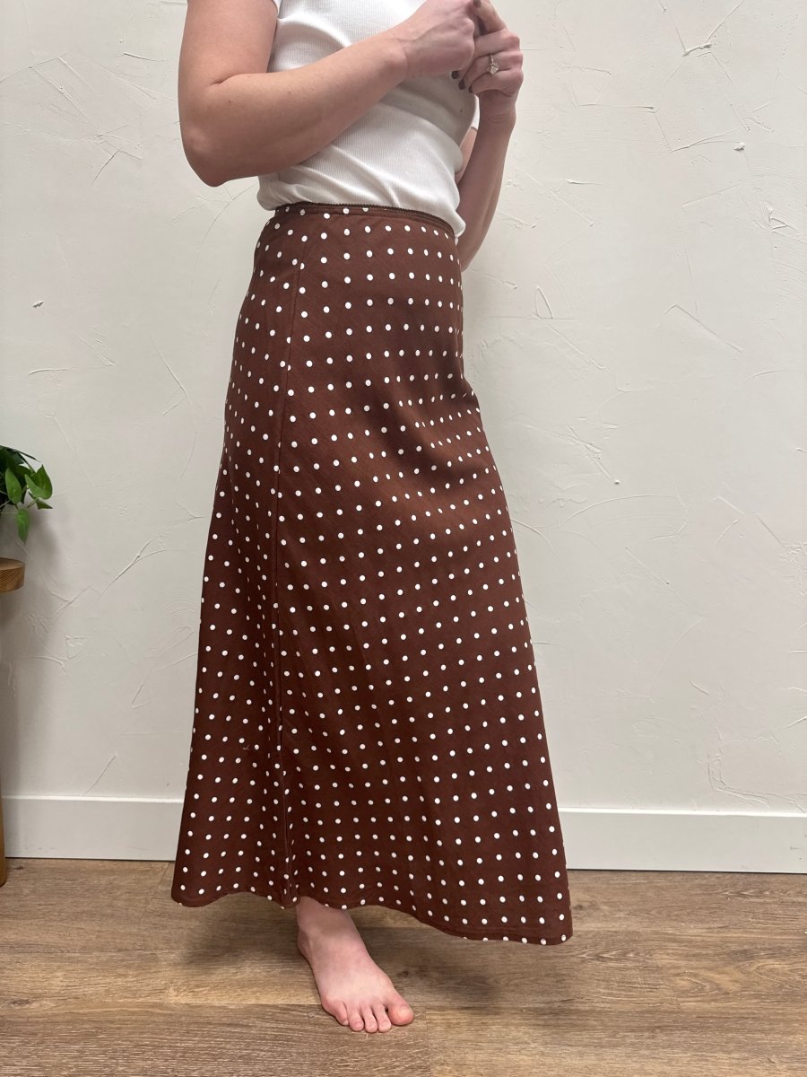 Side view of A-line skirt showing flare and movement — Three:Twelve Boutique