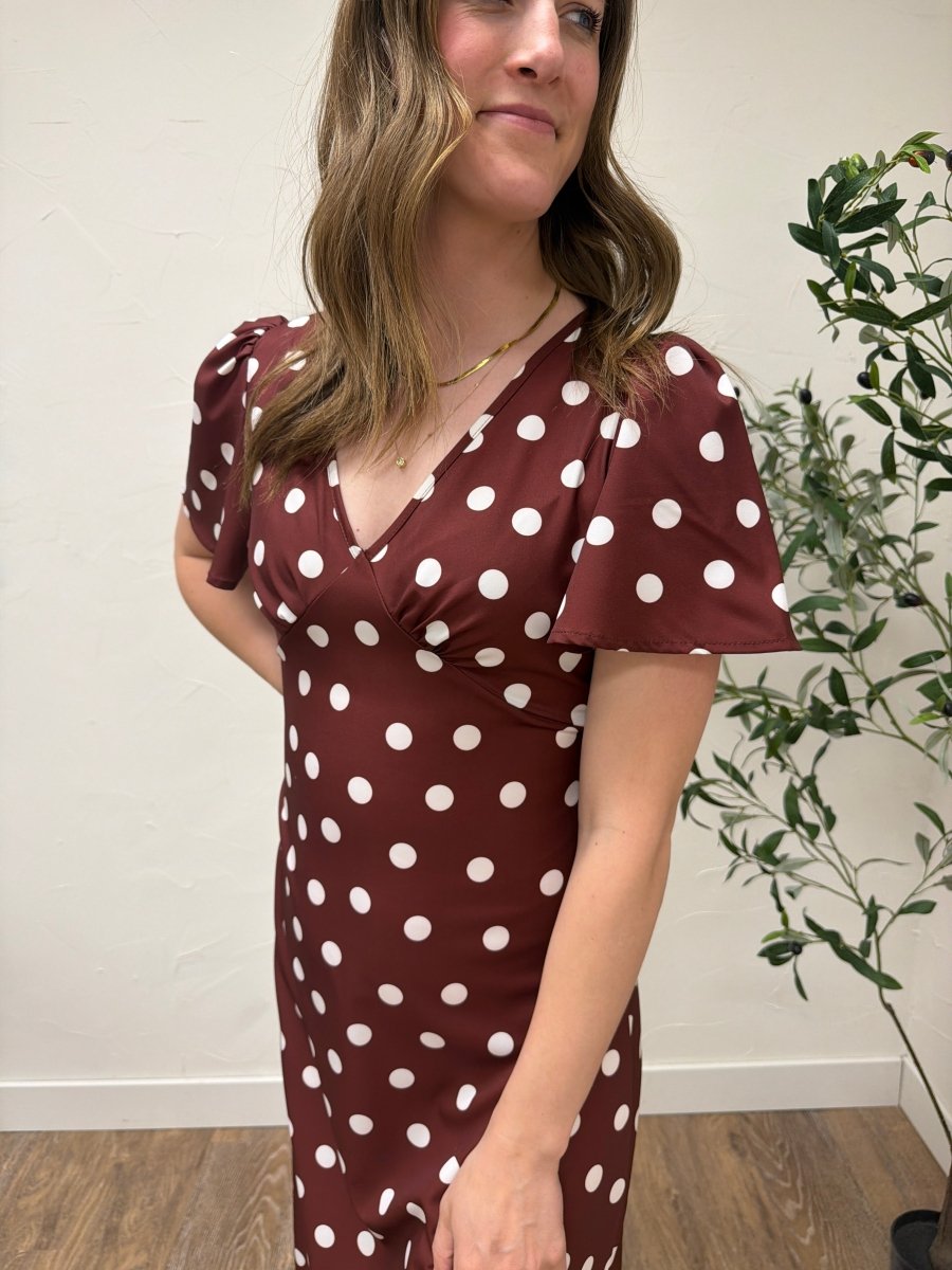 Close up of blue polka dot fabric and pleated texture detail — Three Boutique