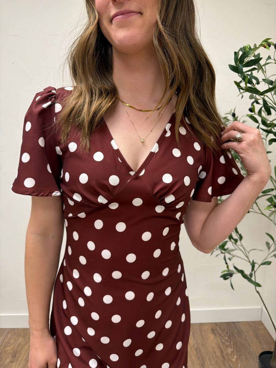 Close up of blue polka dot fabric and pleated texture detail — Three Boutique