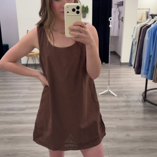 A model wearing Trimmed Dress Romper showing flowy silhouette and trim details — Three:Twelve Boutique