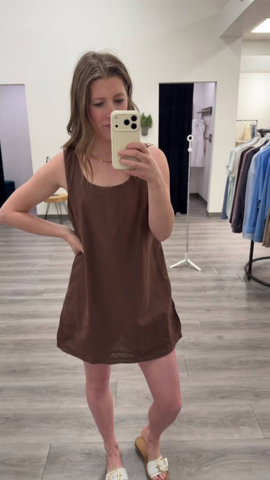 A model wearing Trimmed Dress Romper showing flowy silhouette and trim details — Three:Twelve Boutique