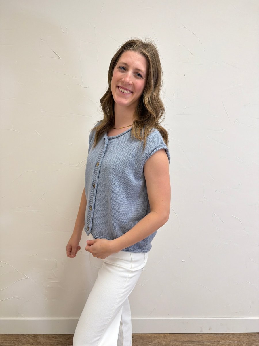Side view of model wearing Raw Edge Sleeveless Button Down Knit Cardigan for Women