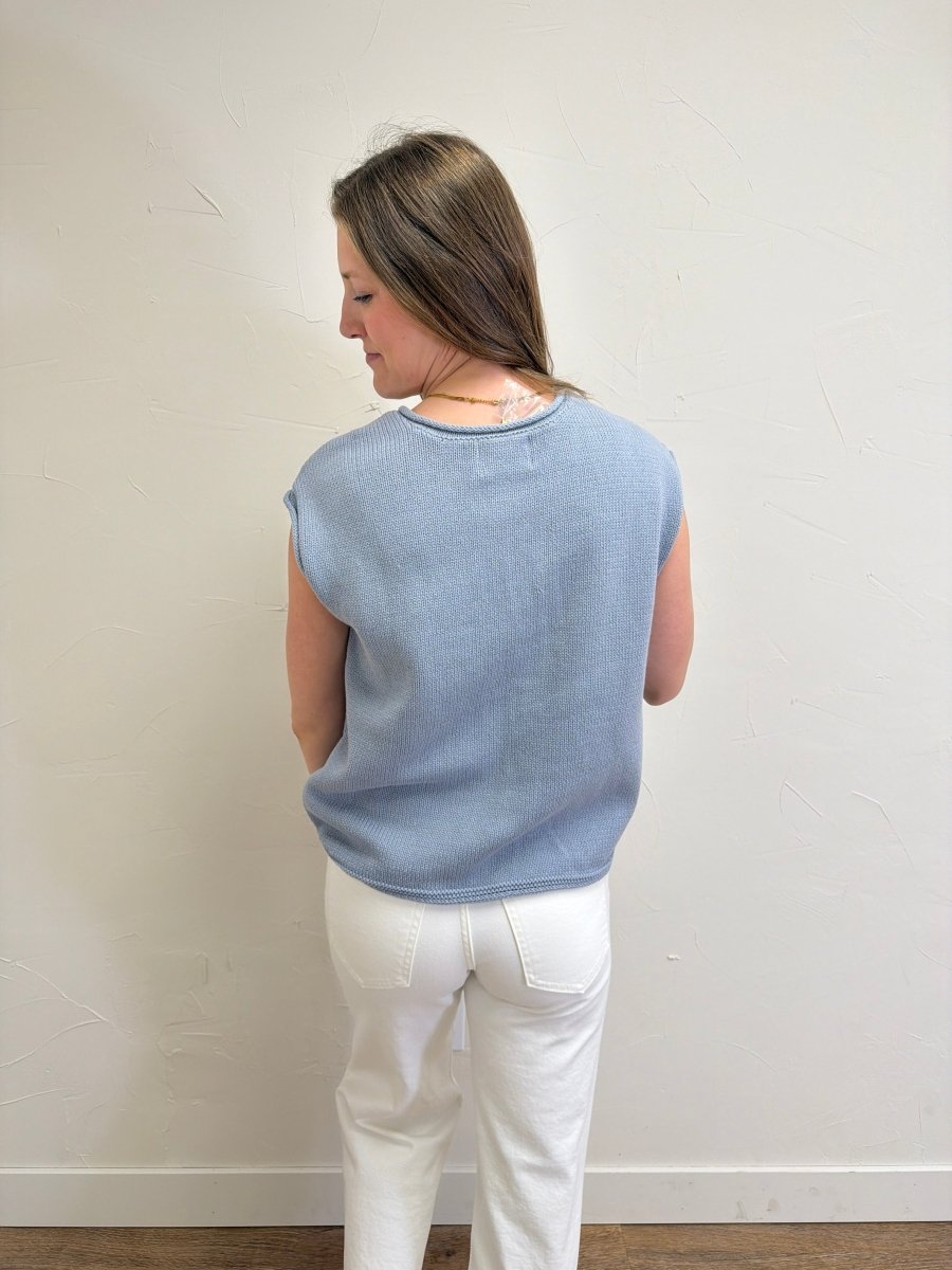 Back view of model wearing Raw Edge Sleeveless Button Down Knit Cardigan for Women