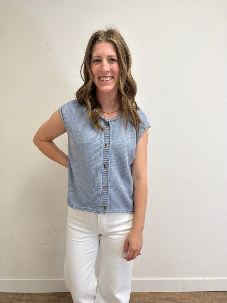 Model wearing Raw Edge Sleeveless Button Down Knit Cardigan styled with casual everyday outfit