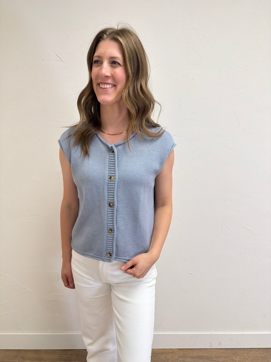 Model wearing Raw Edge Sleeveless Button Down Knit Cardigan styled with casual everyday outfit