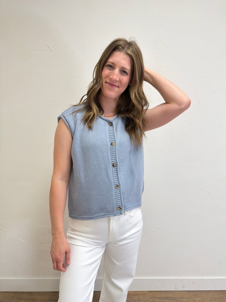 Model wearing Raw Edge Sleeveless Button Down Knit Cardigan styled with casual everyday outfit