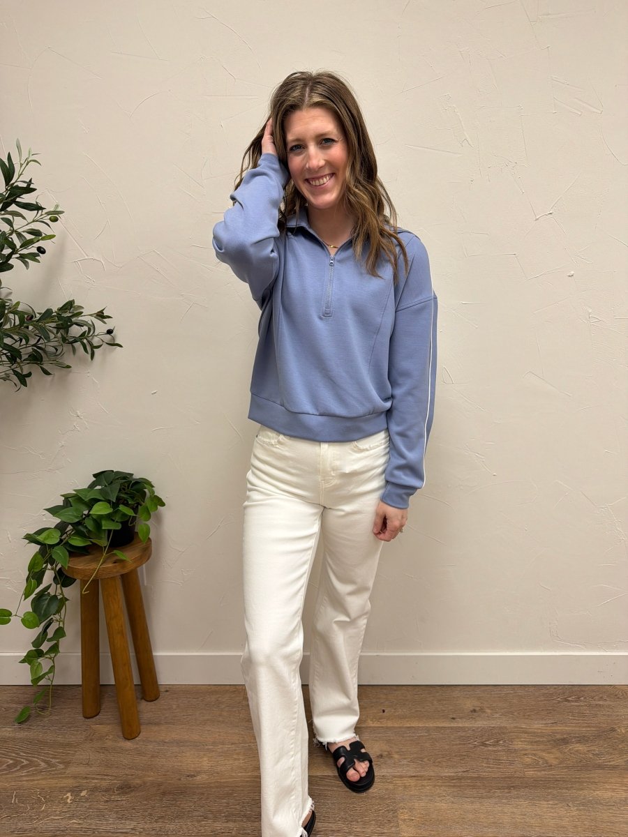 Lifestyle shot of model wearing Regalia Pullover styled casually — Three:Twelve Boutique