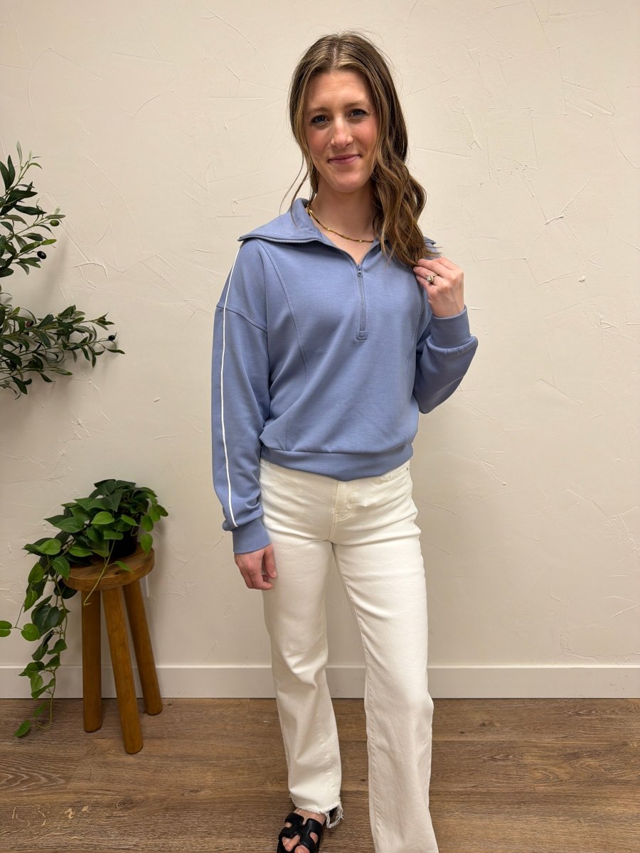 Lifestyle shot of model wearing Regalia Pullover styled casually — Three:Twelve Boutique