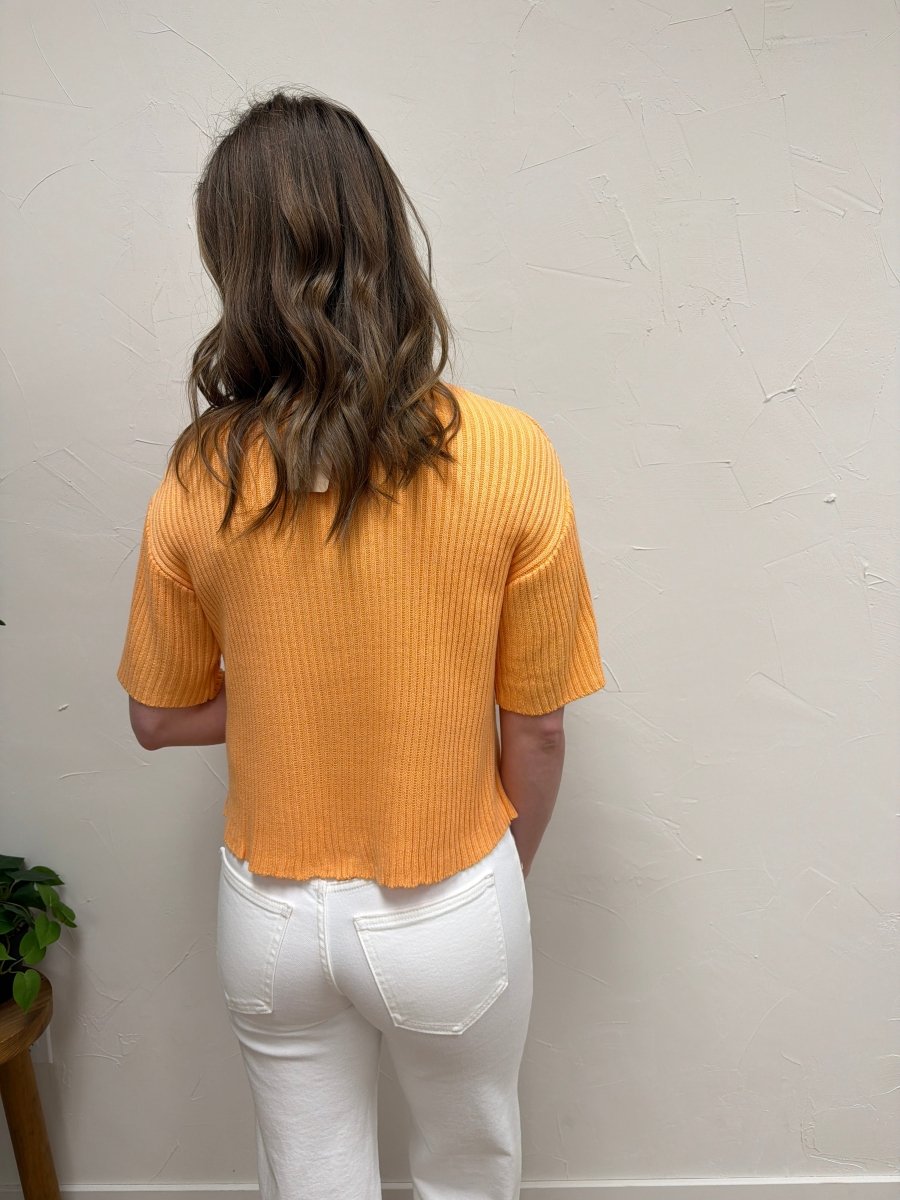 Back view of model wearing half sleeve sweater cardigan showing clean silhouette — Three:Twelve Boutique