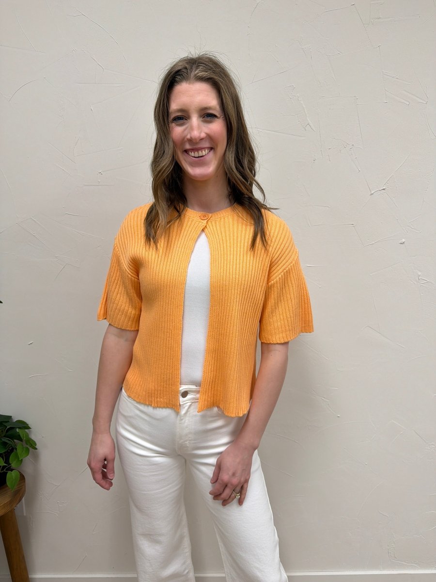 Front view of model wearing round neck one button half sleeve sweater cardigan — Three:Twelve Boutique