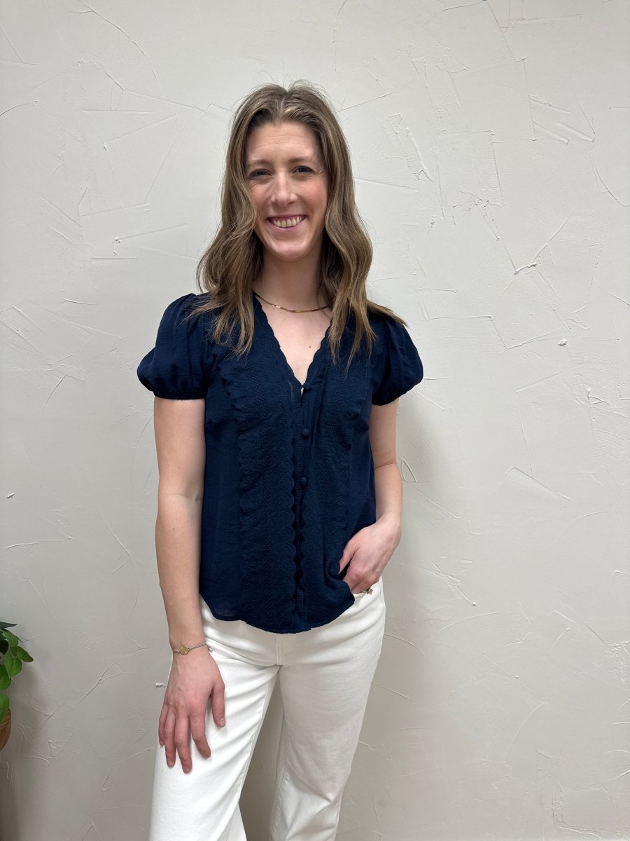 Lifestyle shot of model wearing lace button down top styled with casual outfit — Three:Twelve Boutique