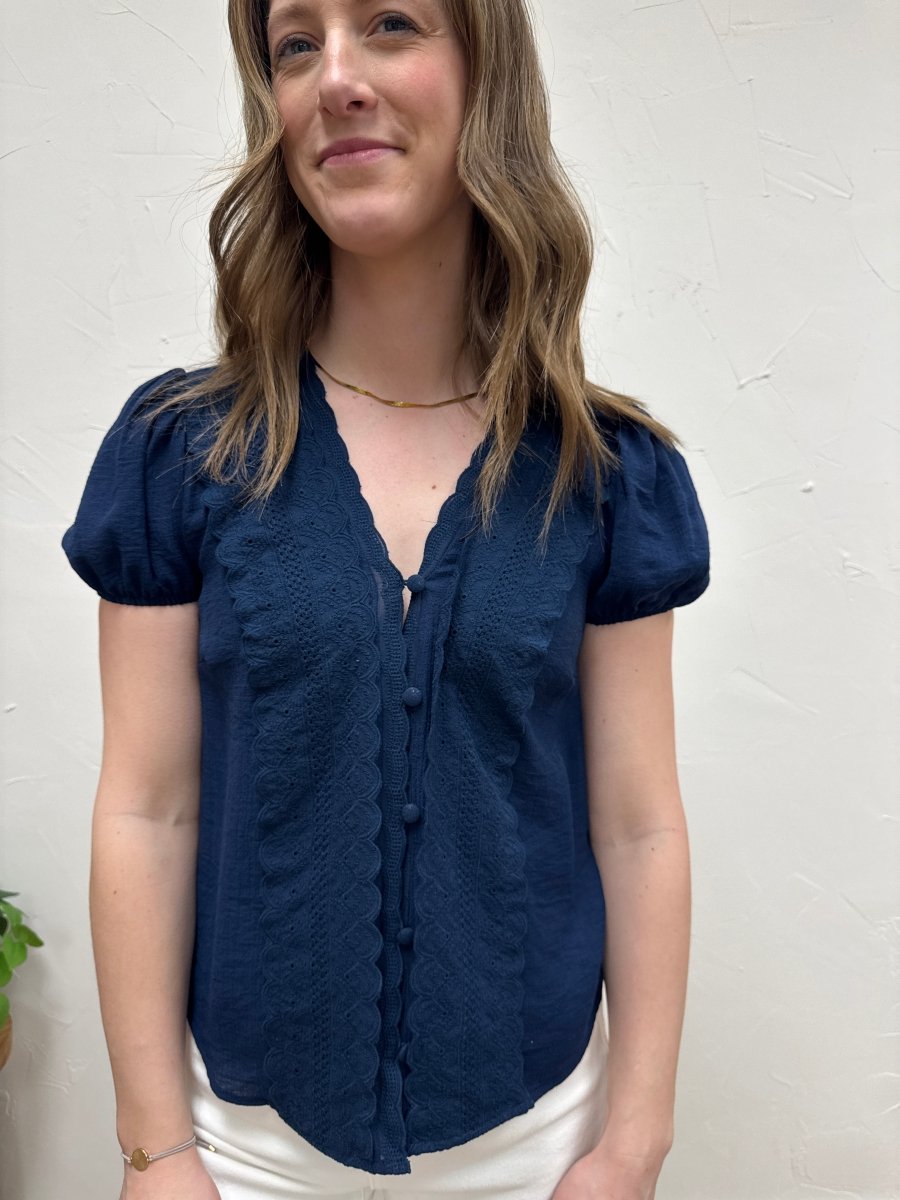 Close up of scallop trim and lace inspired neckline detail — Three:Twelve Boutique