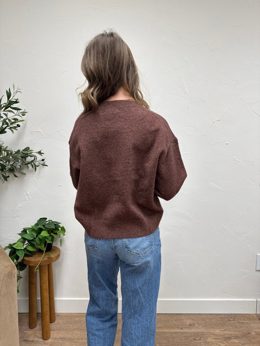 Back view of model wearing seam detail sweater showing relaxed silhouette — Three:Twelve Boutique