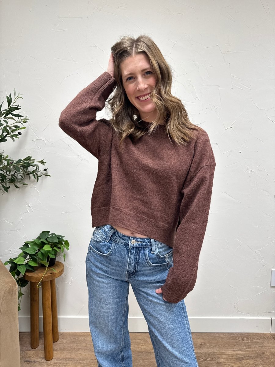 Lifestyle shot of model styling seam detail sweater with casual outfit — Three:Twelve Boutique