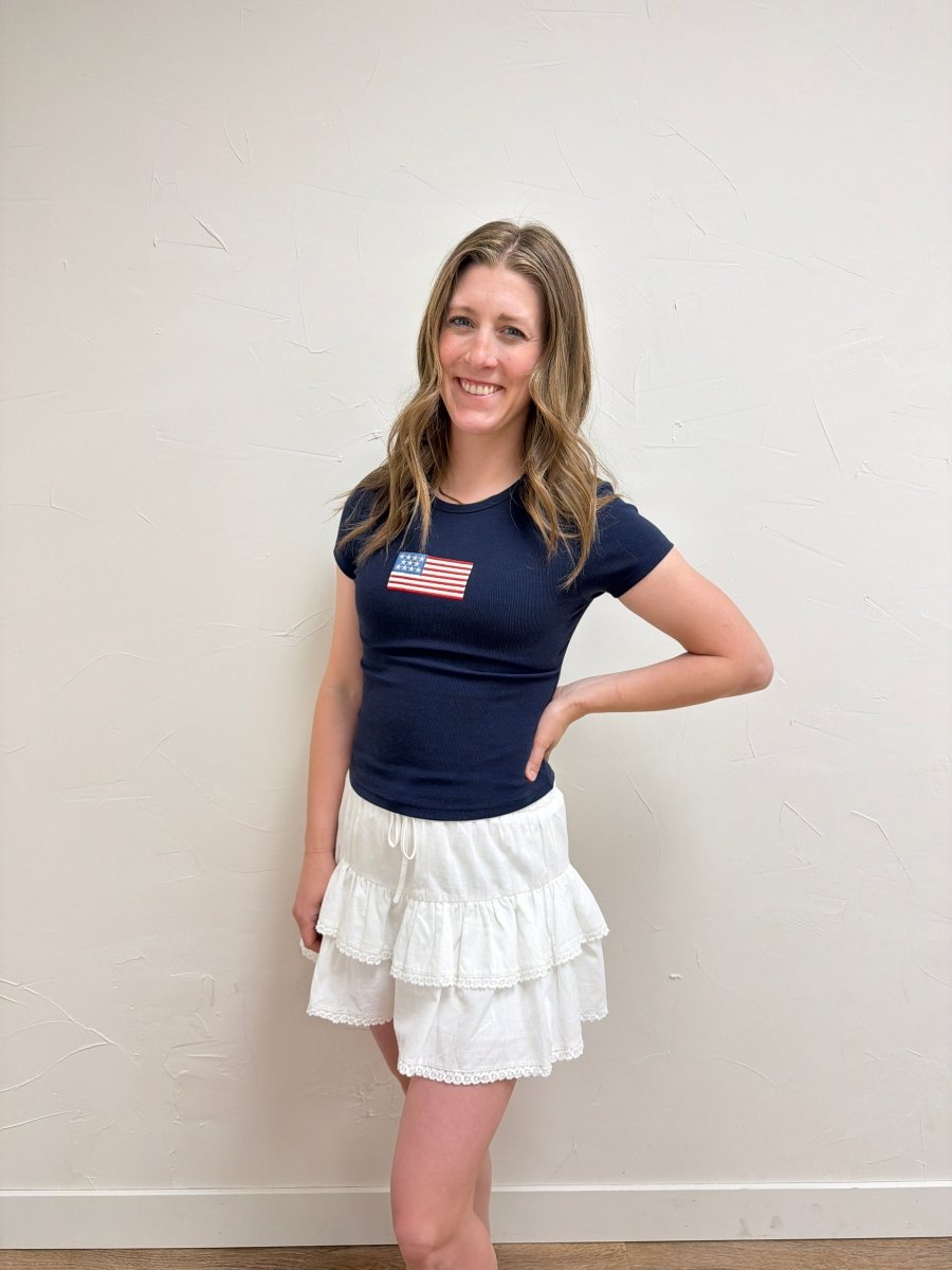 Lifestyle image of model wearing Short Sleeve American Flag Tee with casual denim — Three Boutique