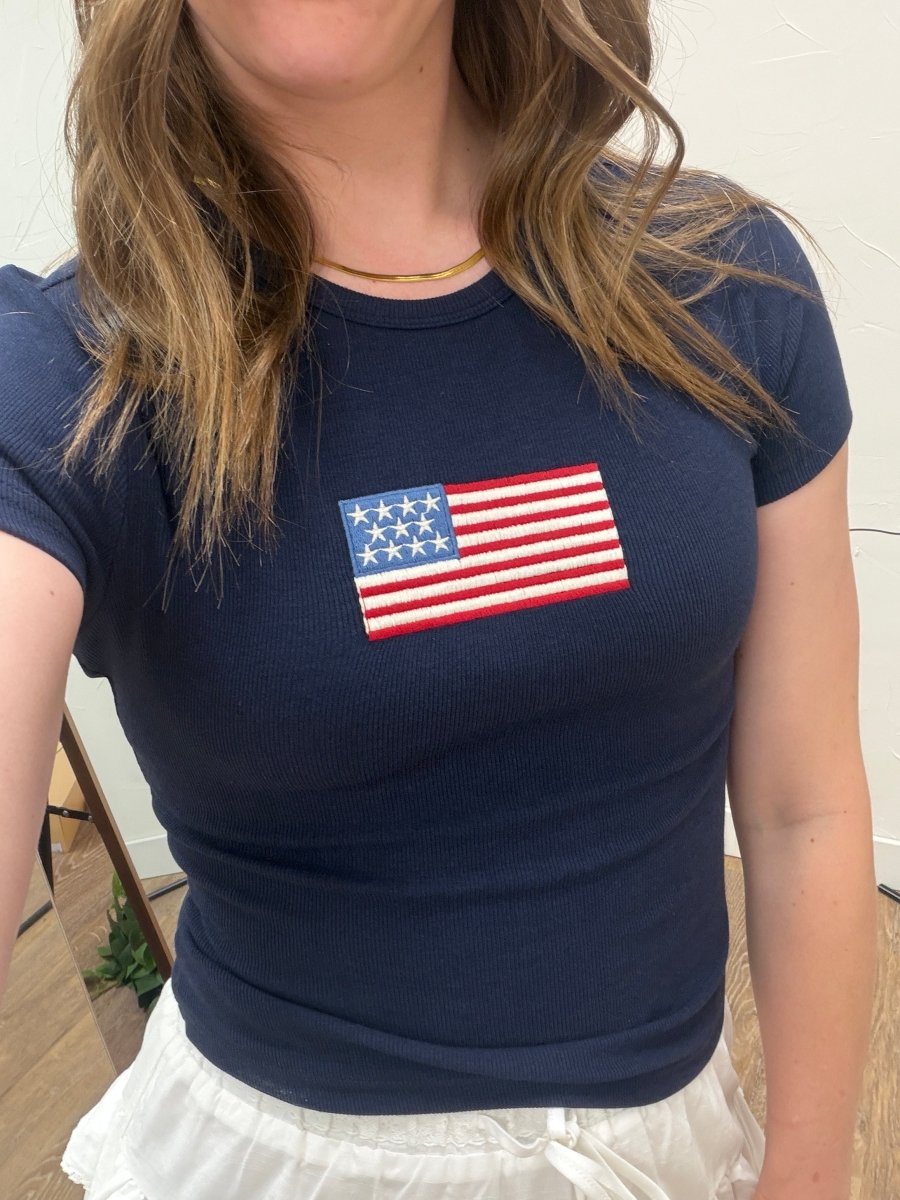 Close up of American flag graphic on Short Sleeve American Flag Tee — Three Boutique