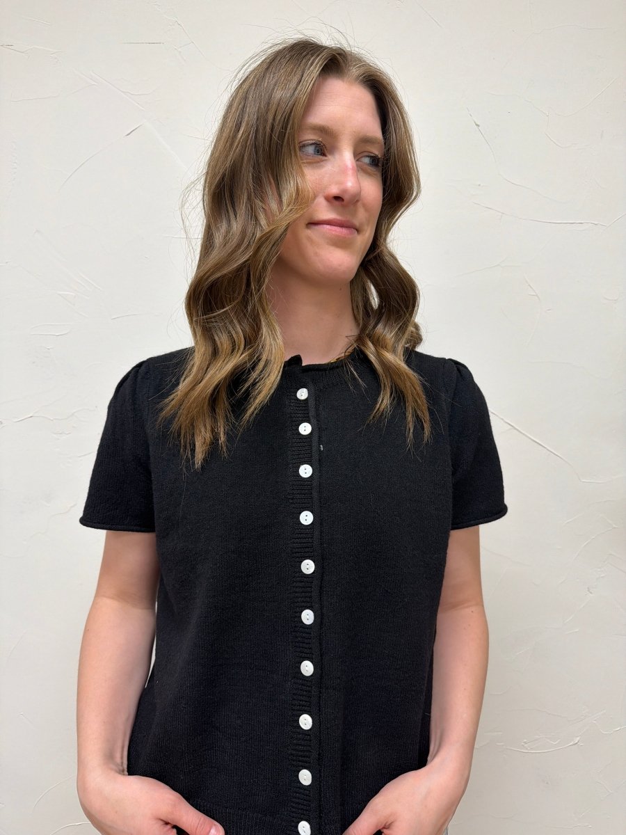 Front view of model wearing short sleeve button cardigan with puff sleeve detail — Three:Twelve Boutique