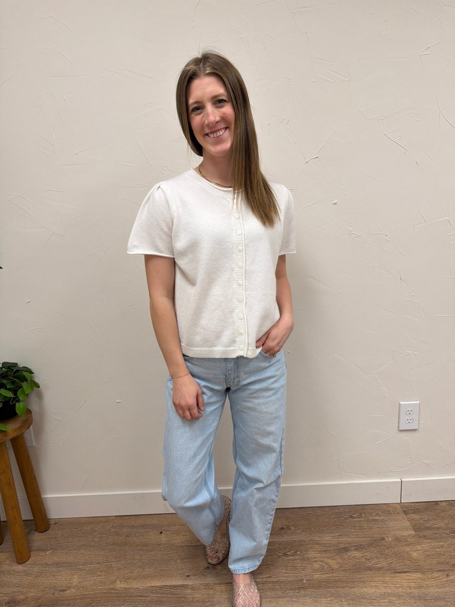 Lifestyle shot of model styling short sleeve cardigan with casual denim outfit — Three:Twelve Boutique