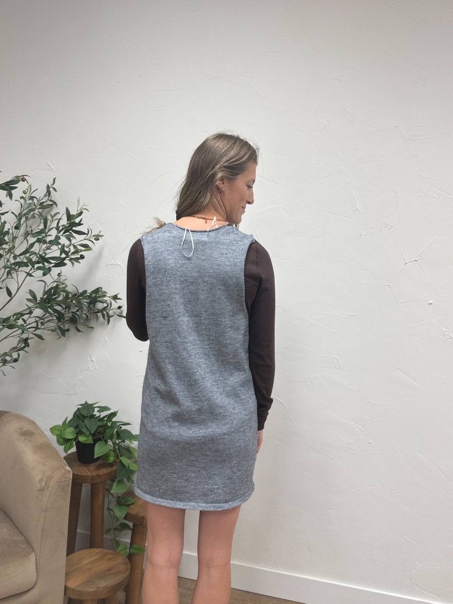 Back view of sweater vest on model showing clean sleeveless design — Three:Twelve Boutique