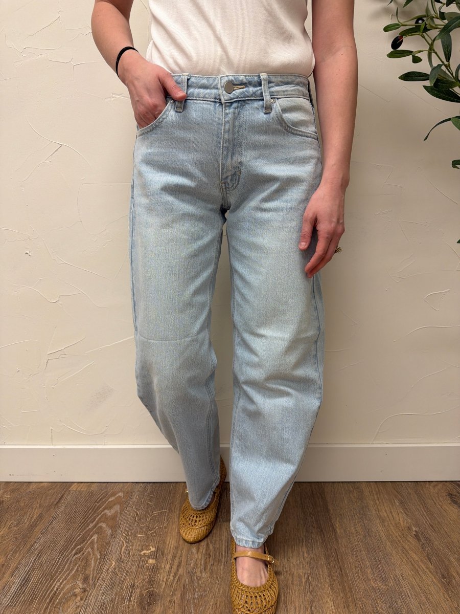 Lifestyle shot of model wearing denim styled with casual top — Three:Twelve Boutique