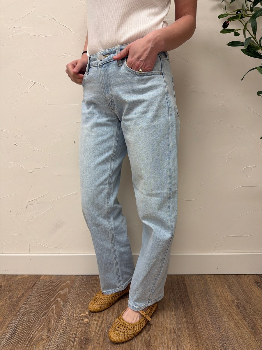 Lifestyle shot of model wearing denim styled with casual top — Three:Twelve Boutique