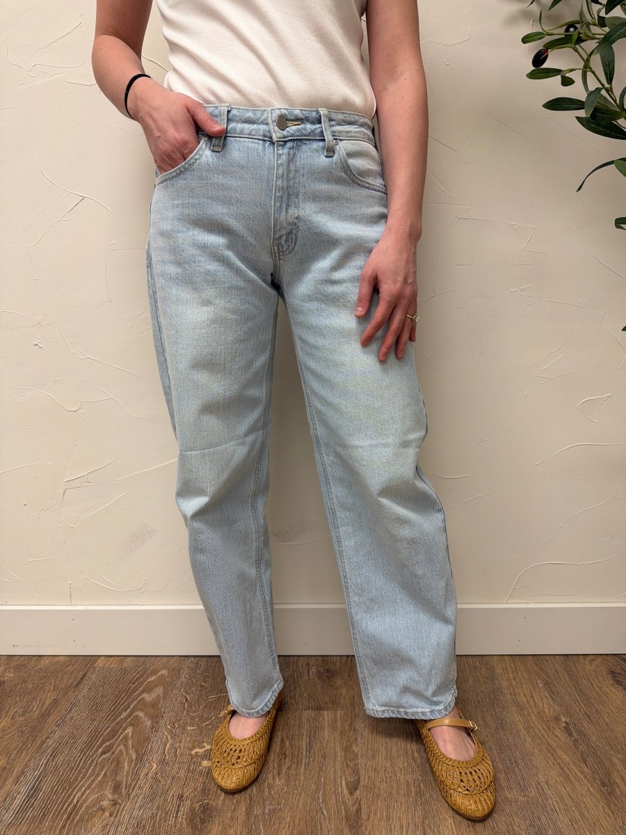 Lifestyle shot of model wearing denim styled with casual top — Three:Twelve Boutique