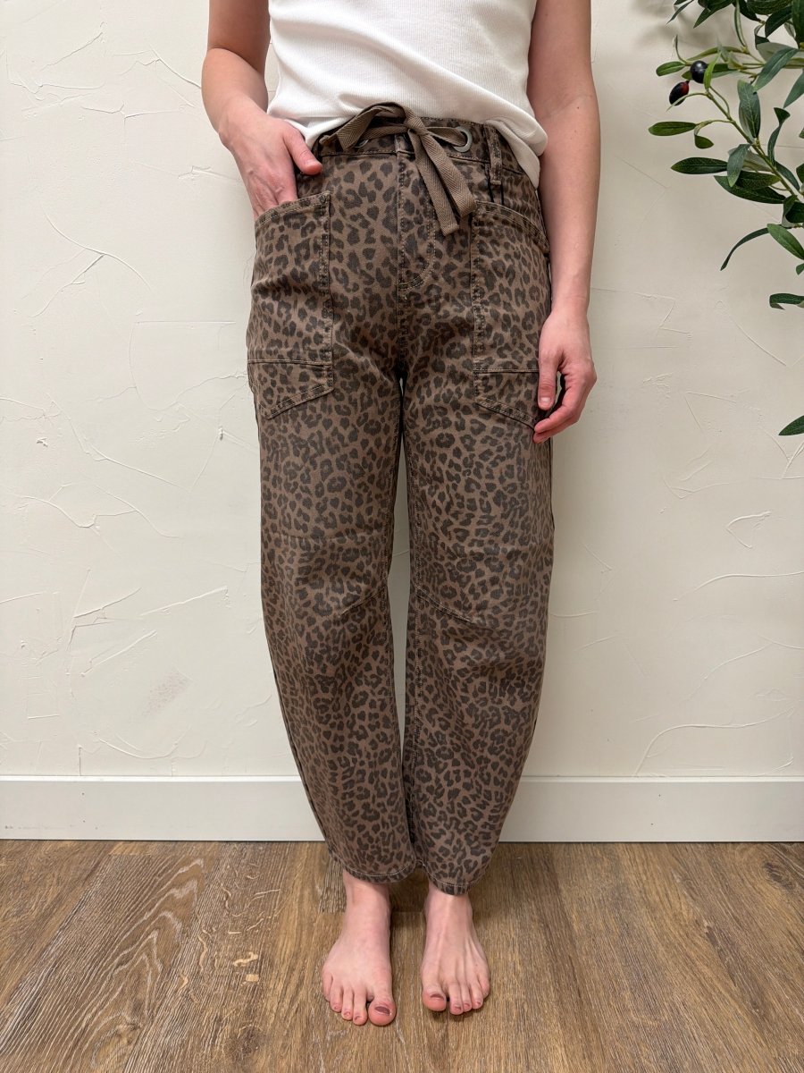 Front view of model wearing slouchy crop barrel jeans with drawstring waistband in leopard print — Three:Twelve Boutique