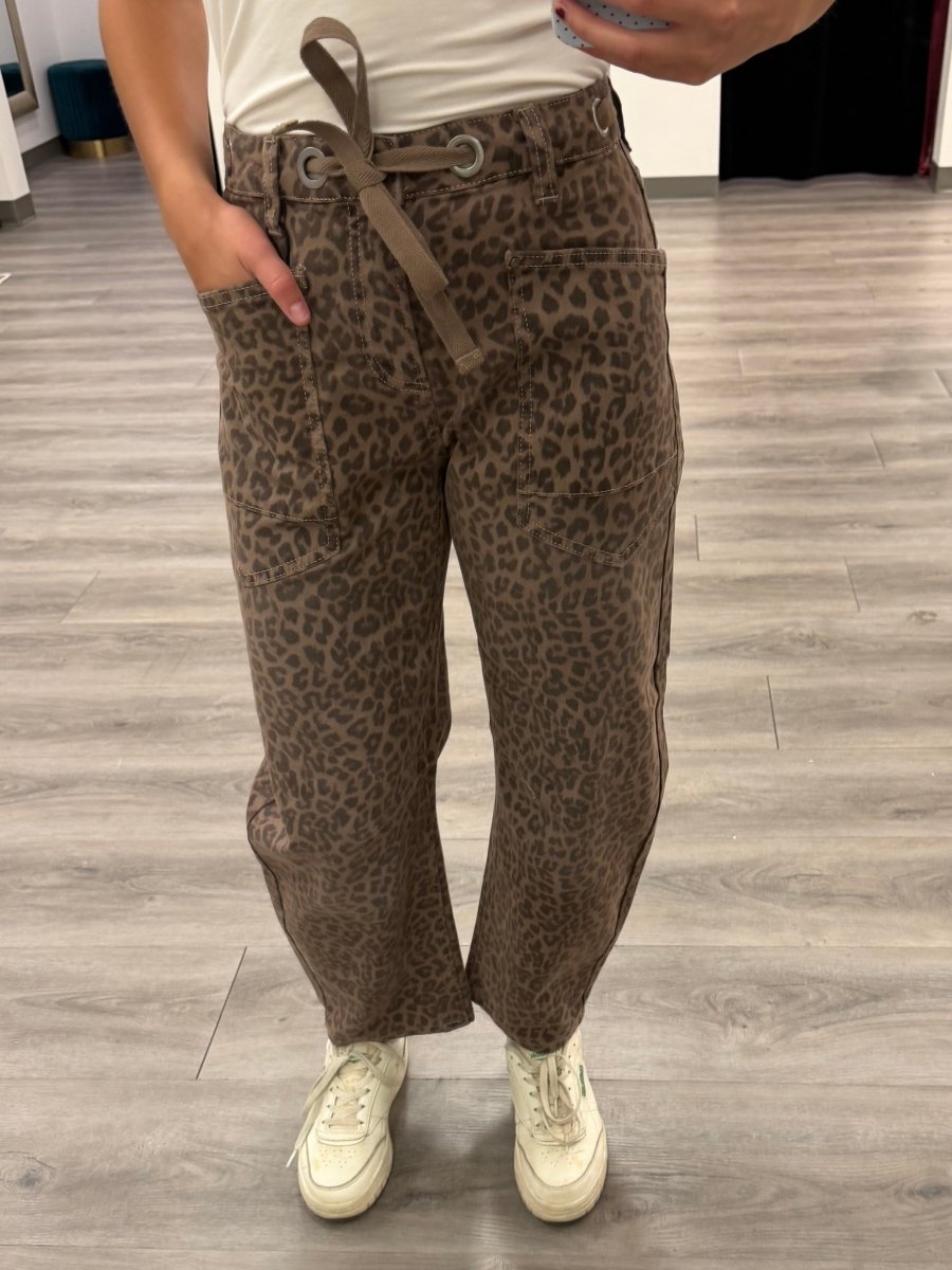 Front view of model wearing slouchy crop barrel jeans with drawstring waistband in leopard print — Three:Twelve Boutique