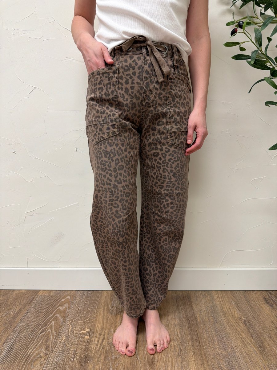 Front view of model wearing slouchy crop barrel jeans with drawstring waistband in leopard print — Three:Twelve Boutique