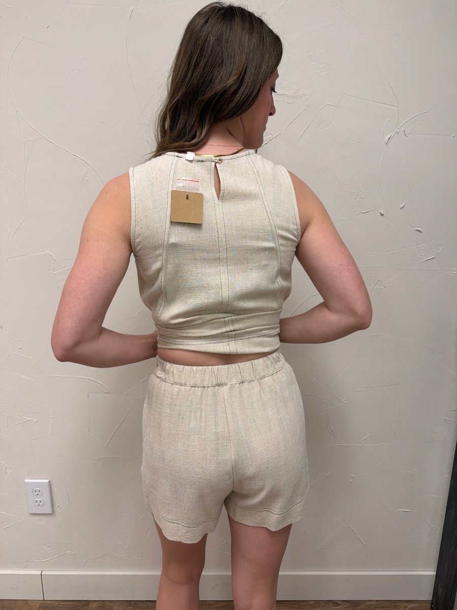 Back view of model wearing stitch detail mini shorts showing relaxed fit — Three:Twelve Boutique