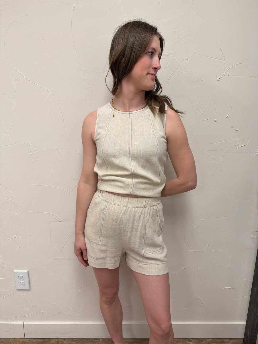 Lifestyle shot of model wearing mini shorts styled with matching top — Three:Twelve Boutique