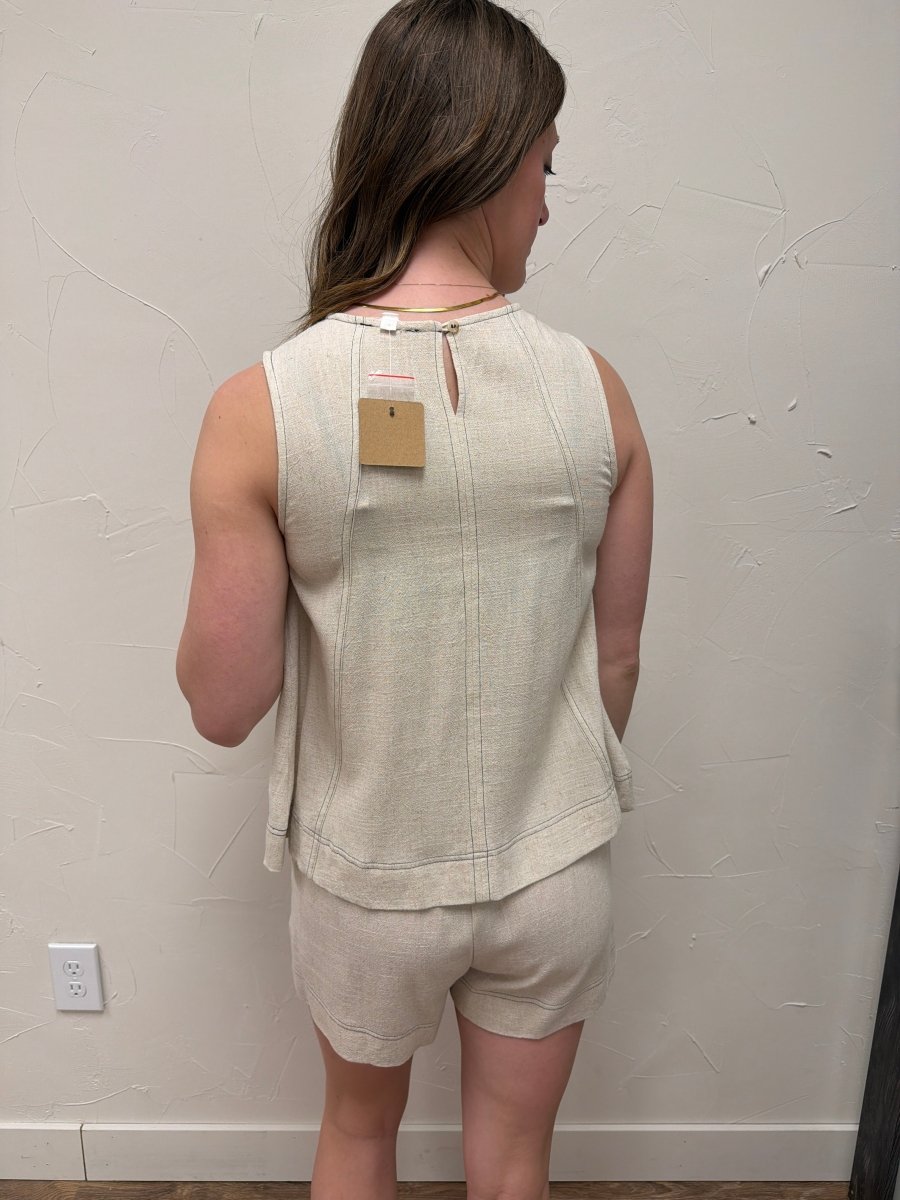 Back view of sleeveless top on model highlighting clean silhouette — Three:Twelve Boutique
