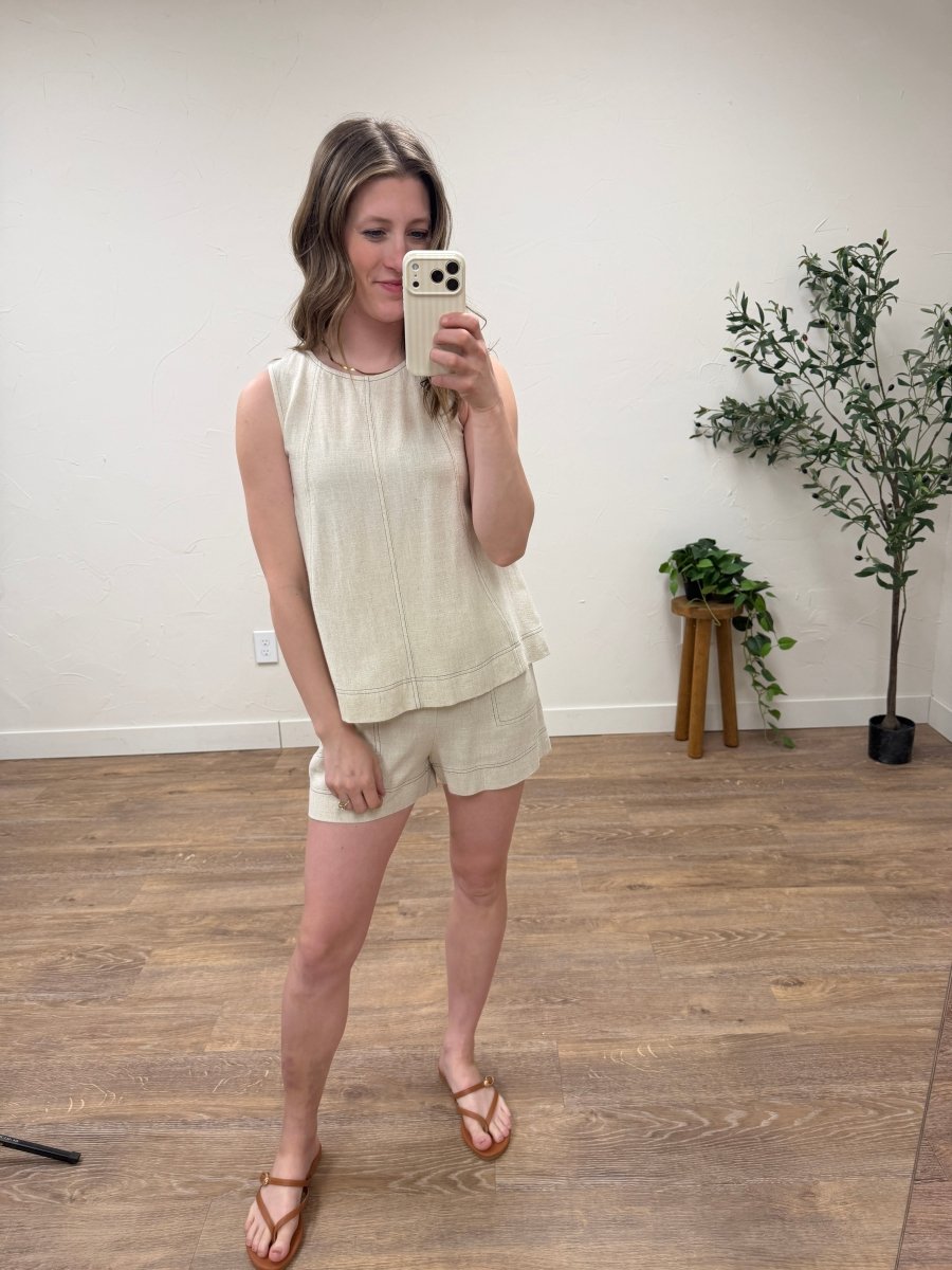 Lifestyle shot of model wearing sleeveless top styled with matching bottom — Three:Twelve Boutique