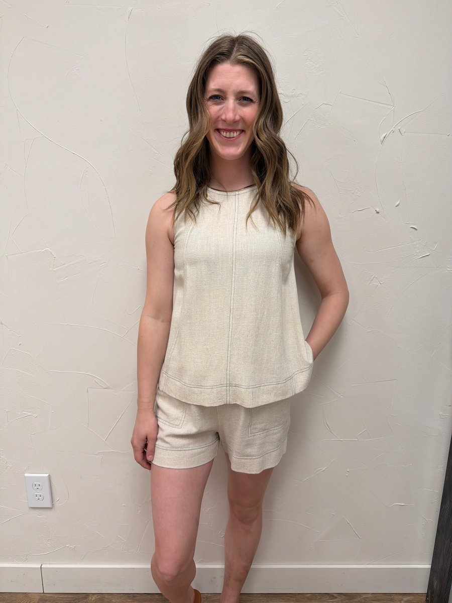 Lifestyle shot of model wearing sleeveless top styled with matching bottom — Three:Twelve Boutique