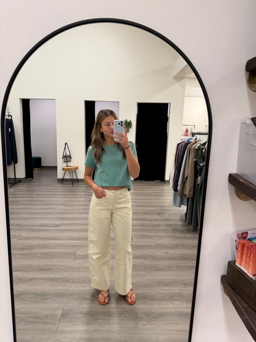 Front view of model wearing straight polka dot pants with low waist fit — Three:Twelve Boutique