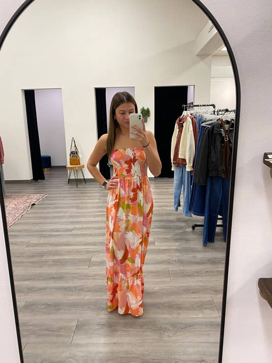 Front view of strapless vibrant floral smocked maxi dress on model — Three:Twelve Boutique