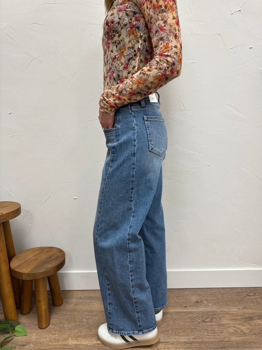 Side view of barrel twist jeans showing curved leg silhouette — Three:Twelve Boutique