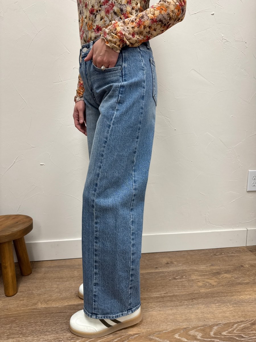 Side view of barrel twist jeans showing curved leg silhouette — Three:Twelve Boutique