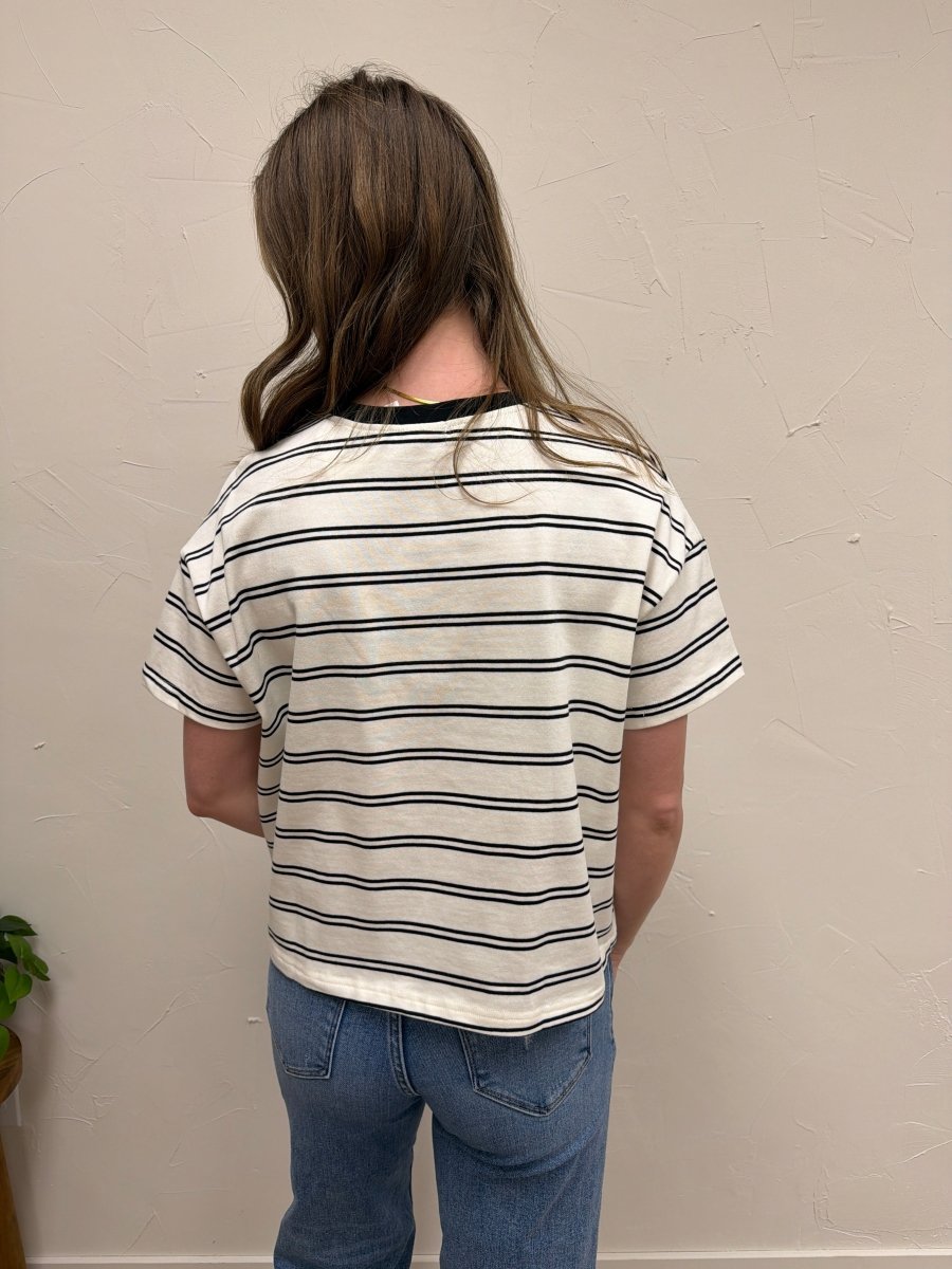 Back view of model wearing striped knit top highlighting hem and fit — Three:Twelve Boutique