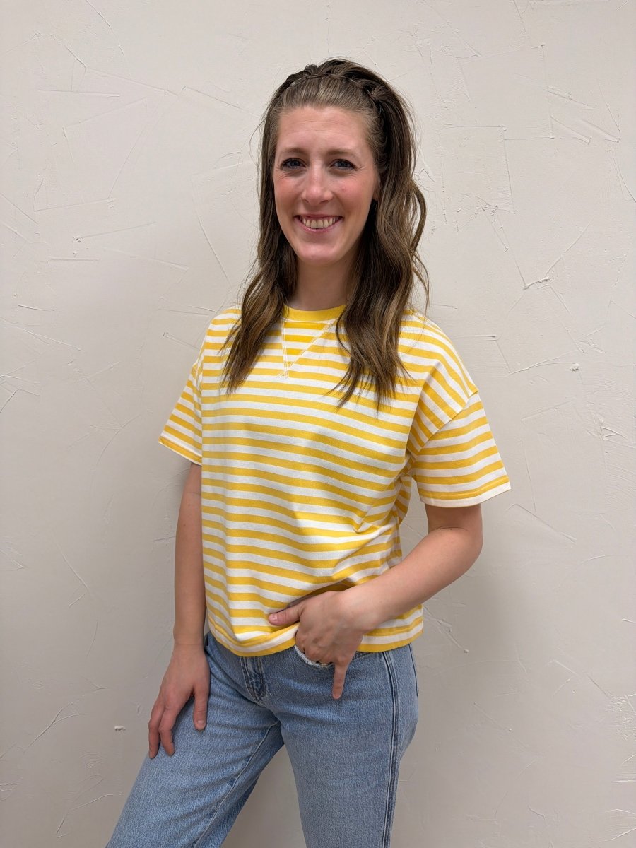 Lifestyle shot of model wearing striped contrast knit tee with casual denim — Three:Twelve Boutique