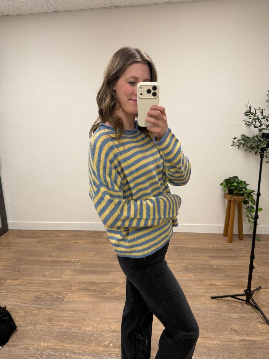 Side angle view of striped pullover sweater showing drape and fit — Three:Twelve Boutique