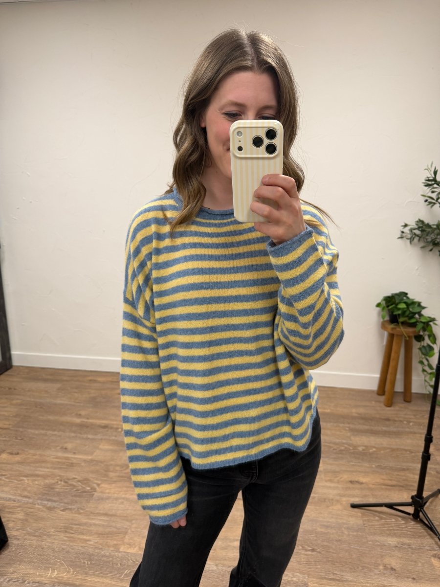 Lifestyle shot of model wearing striped sweater styled with casual outfit — Three:Twelve Boutique