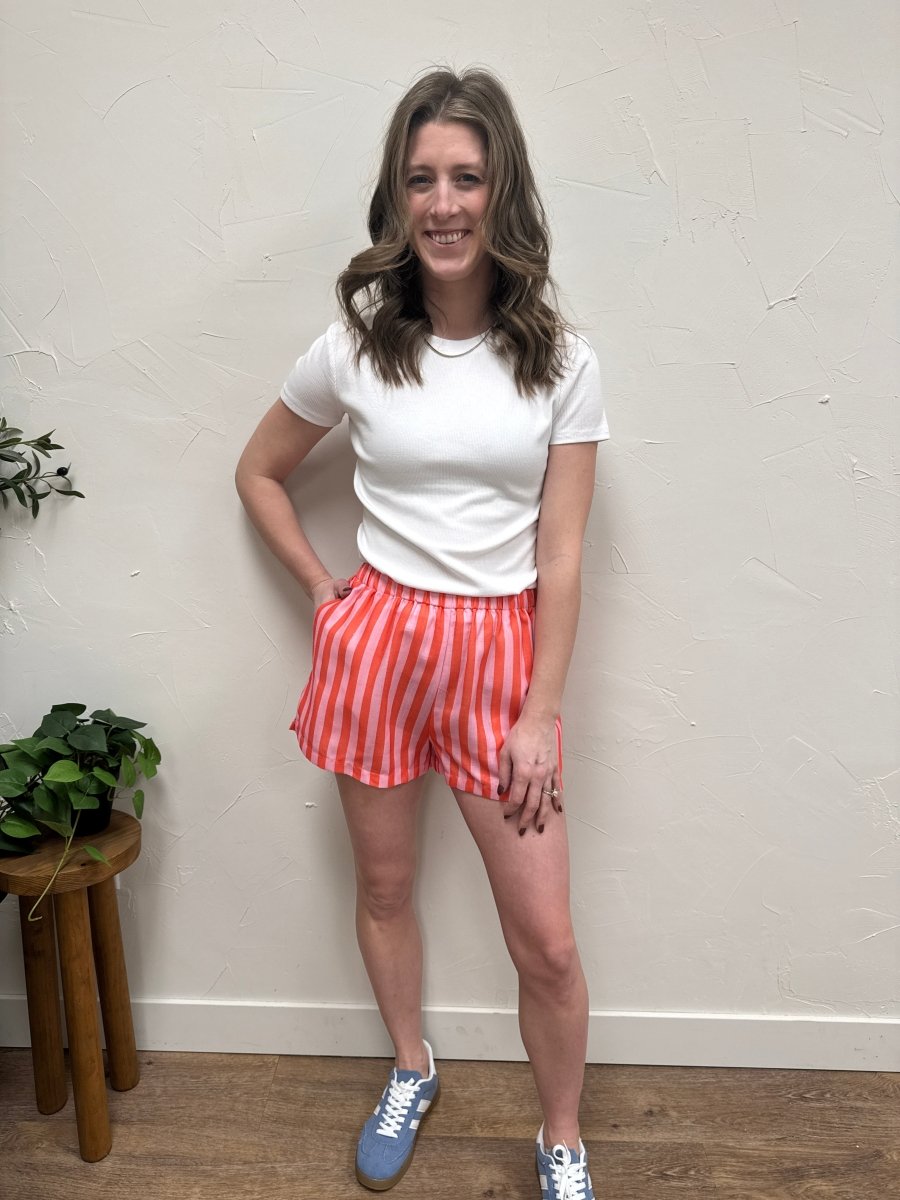 Lifestyle shot of model wearing striped shorts with casual top — Three:Twelve Boutique