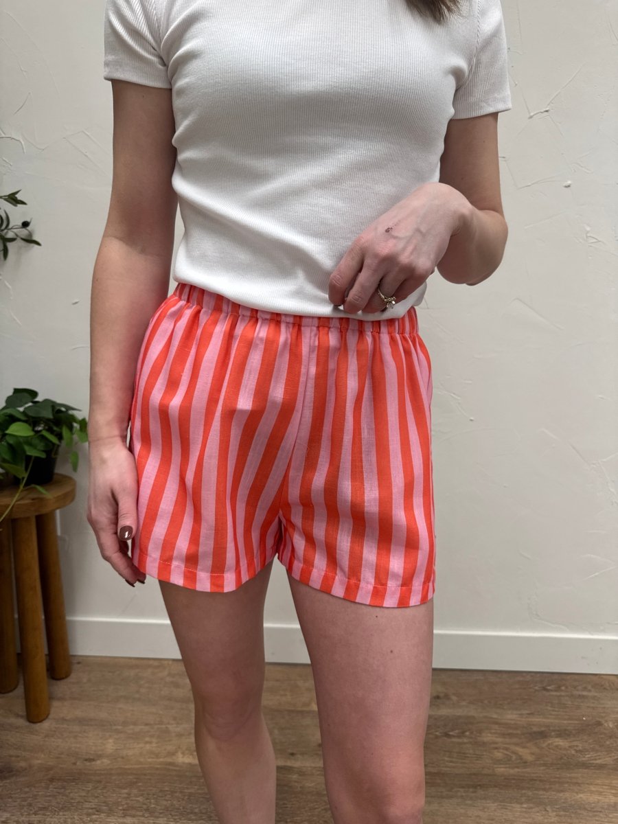 Front view of striped shorts on model showing high waisted fit — Three:Twelve Boutique