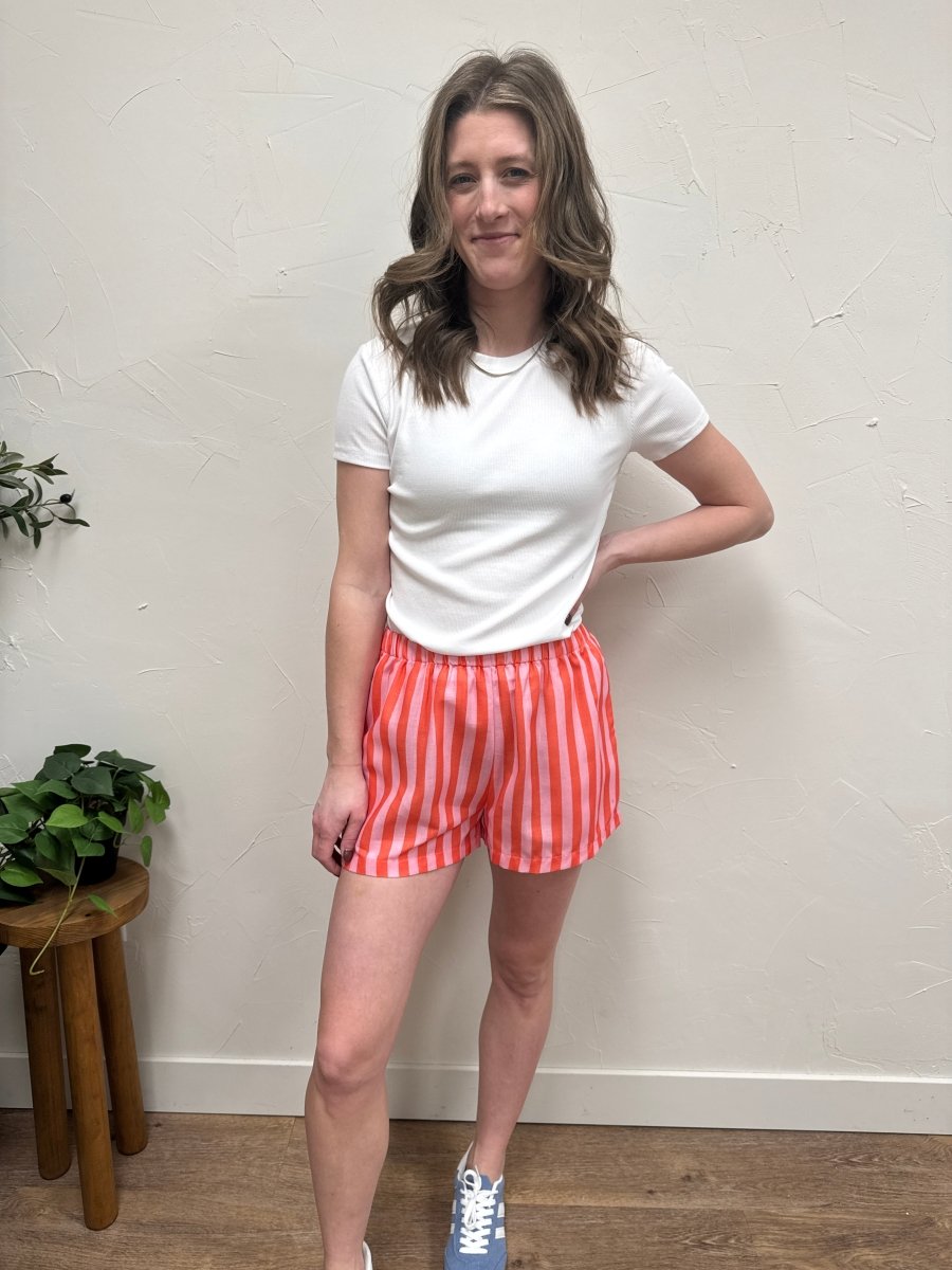 Lifestyle shot of model wearing striped shorts with casual top — Three:Twelve Boutique