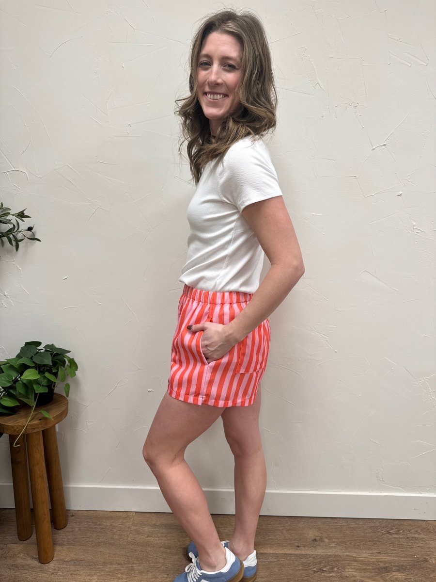 Side angle view of striped shorts highlighting length and fit — Three:Twelve Boutique