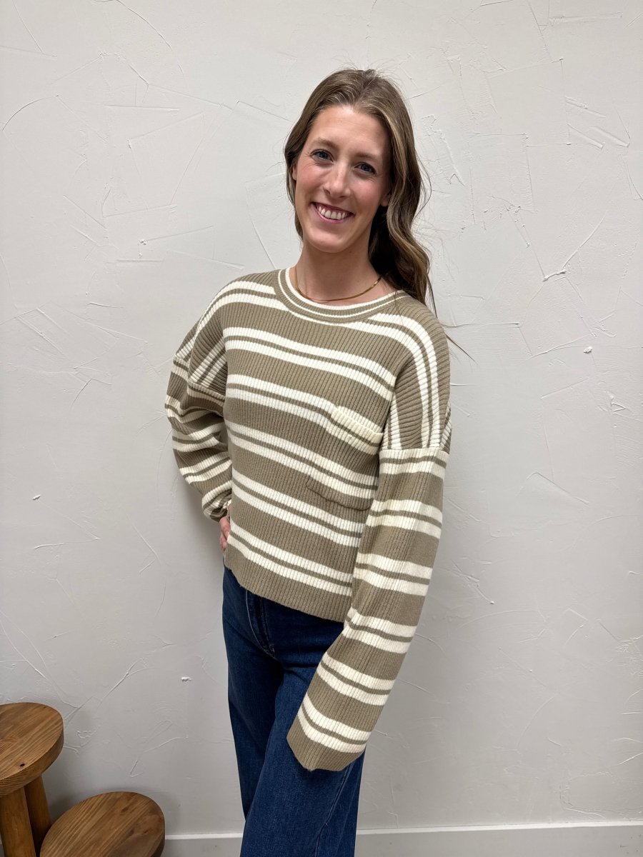 Lifestyle shot of model wearing striped sweater styled casually — Three:Twelve Boutique